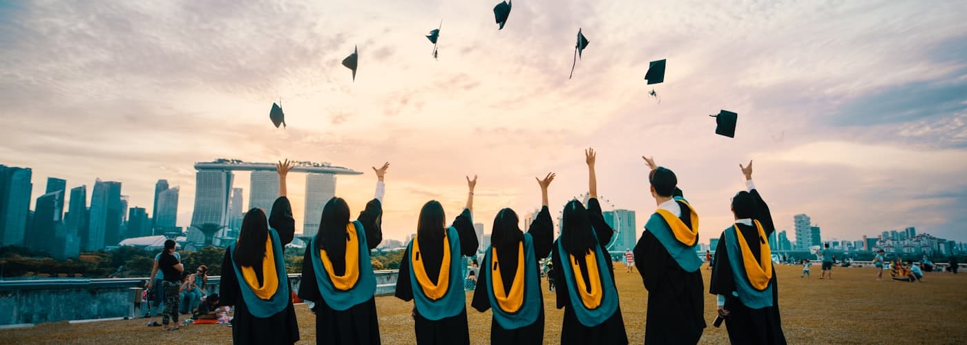 Graduates celebrating on campus